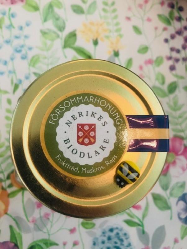 Lock till honungsburk i guld, märkt 